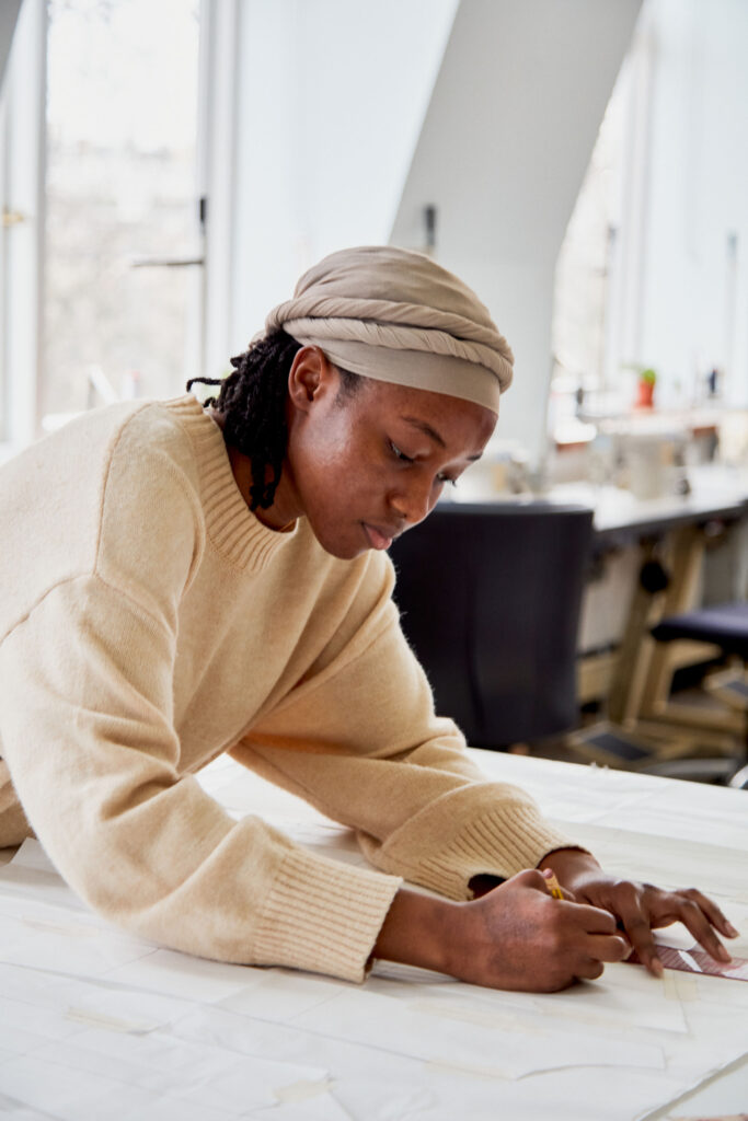 Fashion design student sketching her project at Regents University London