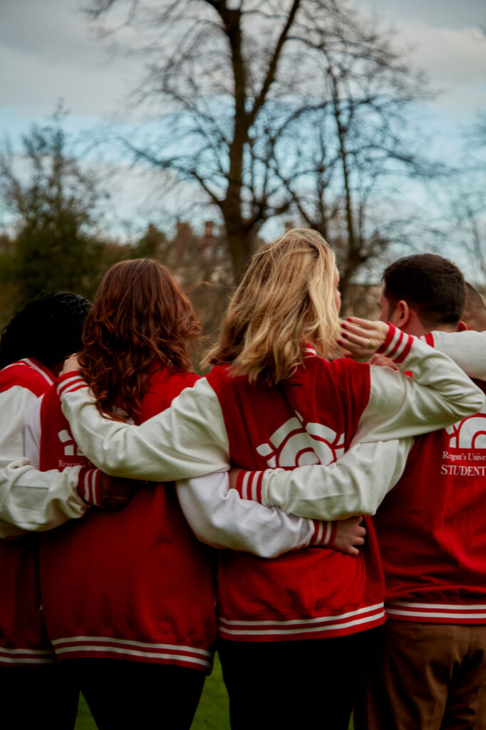 United and proud: Students Union members embracing in a group photo outside of Regent's university in London